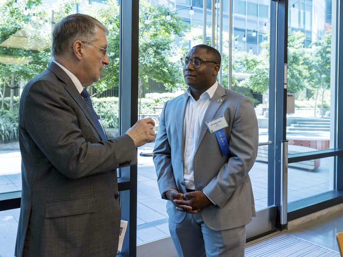 Bradford Paul, ABAG's Deputy Executive Director for Local Government Services, talks with a delegate at the 2023 ABAG General Assembly.