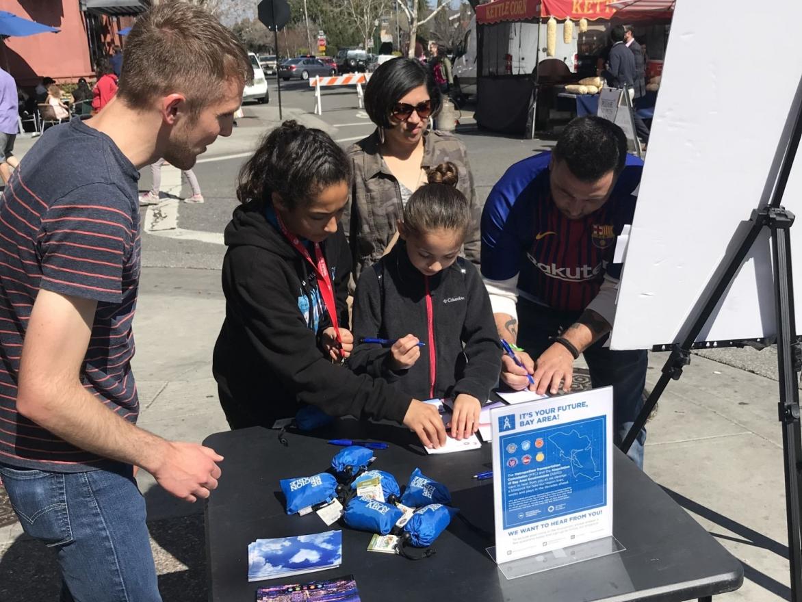 Shoppers at the Campbell Farmer's Market take a moment to give their input.