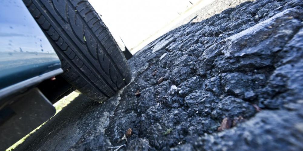 car tire on potholes 