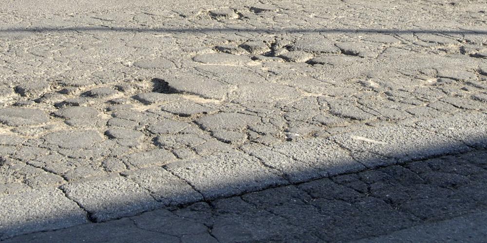 Badly cracked pavement.