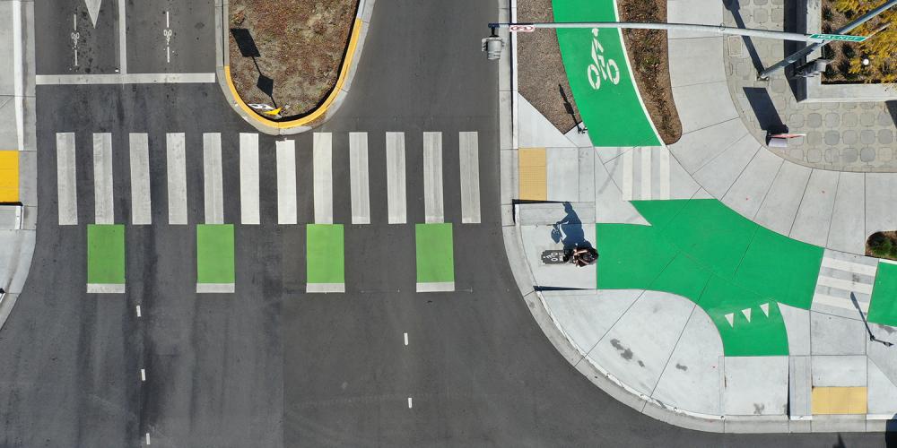 Aerial view of a crosswalk and separated bike lane.