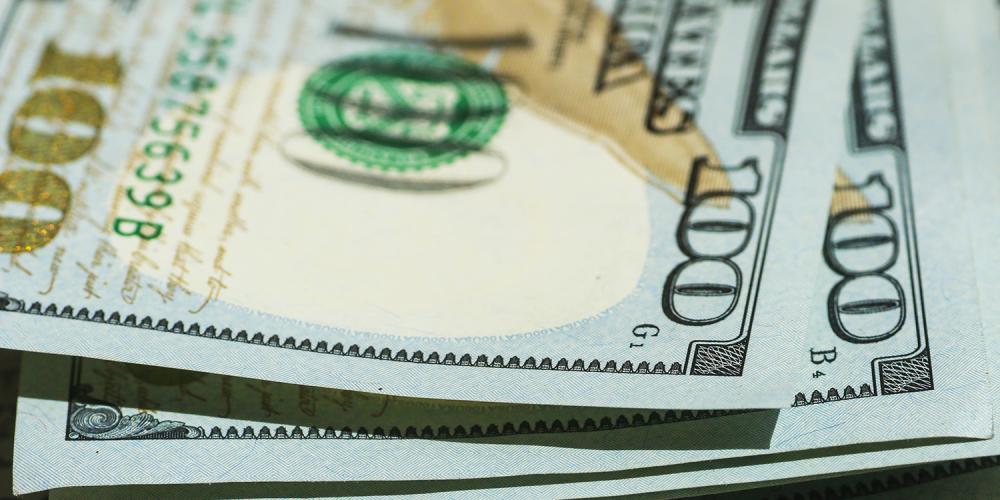 Closeup of several $100 U.S. bills.