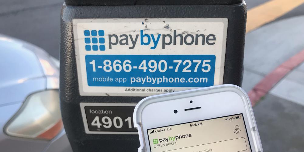 A parking meter with Pay By Phone app.