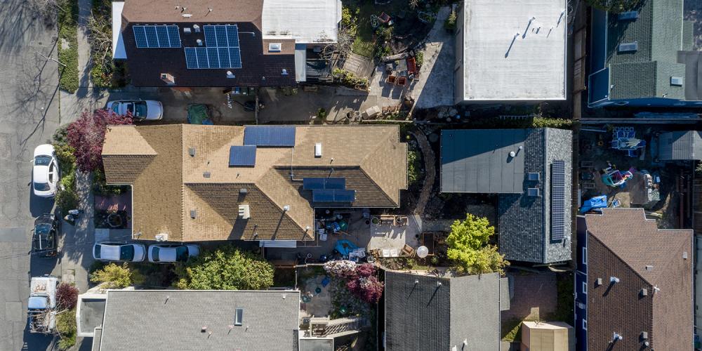 Aerial view of rooftops in a residential neighborhood.
