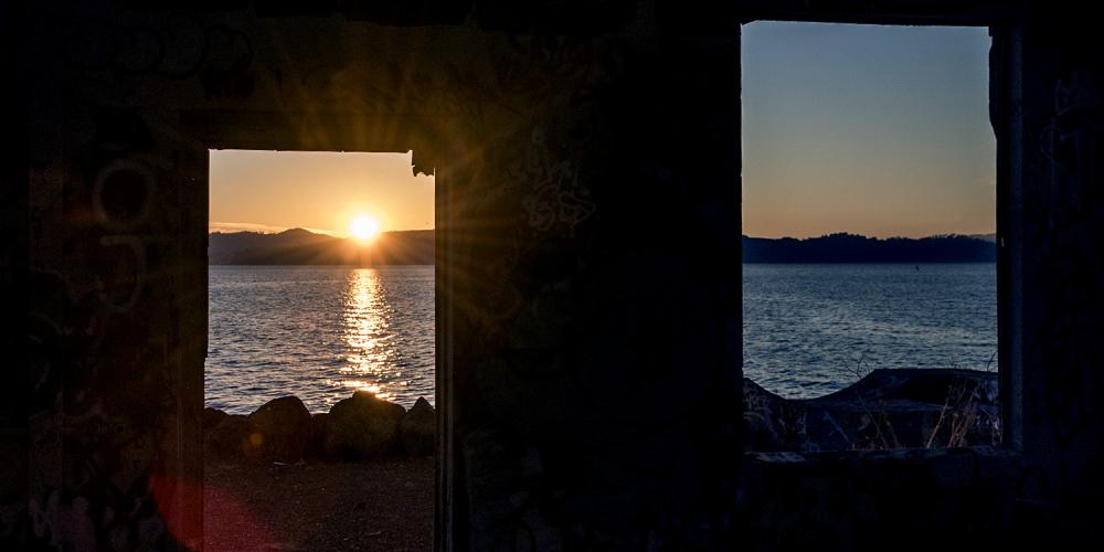 Sunrise as seen through two open windows.