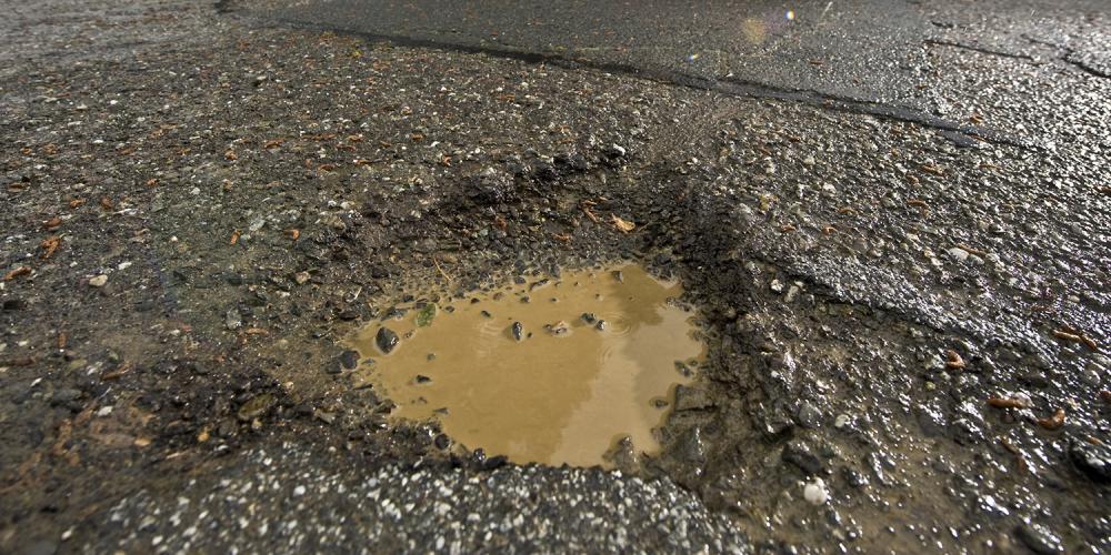 A rain-filled pothole in Oakland.