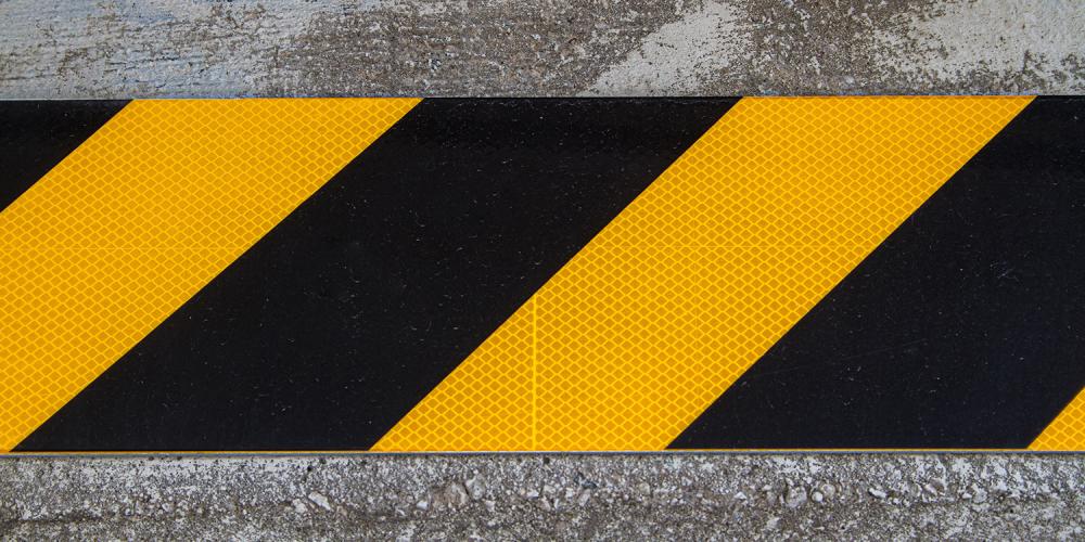 Black and yellow striped caution sign.