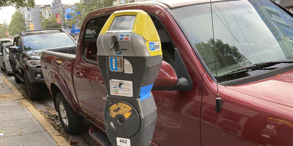 A parking meter on a street in San Francisco.