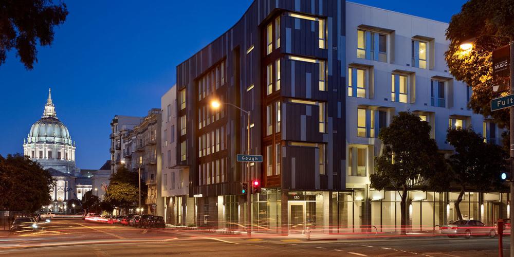 The Richardson Housing supportive housing complex in San Francisco, with a view of City Hall in the background.