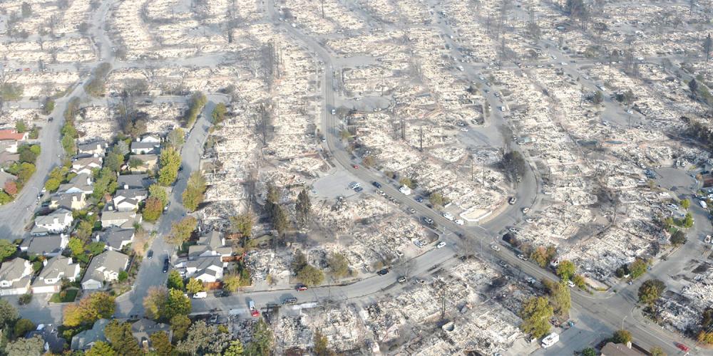 Aerial over Santa Rosa showing a neighborhood damaged by wildfire.