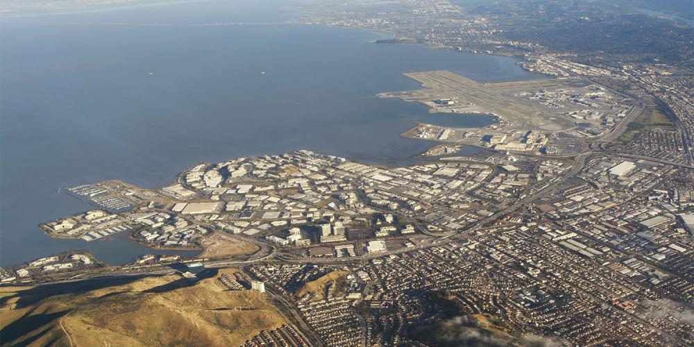 Aerial of a community at the water's edge.