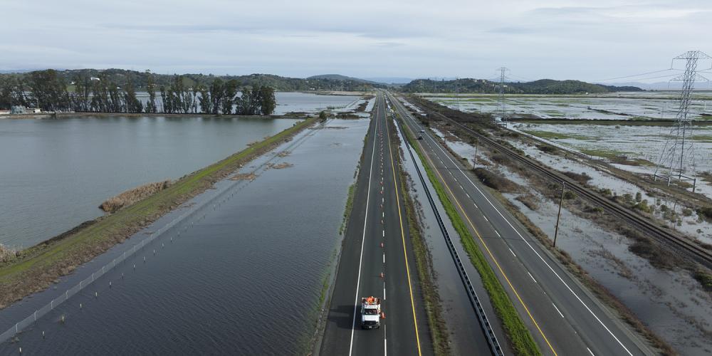 Highway 37 is closed to traffic while CalTrans crews pump flood waters from Novato Creek and the San Francisco Bay off the roadway.