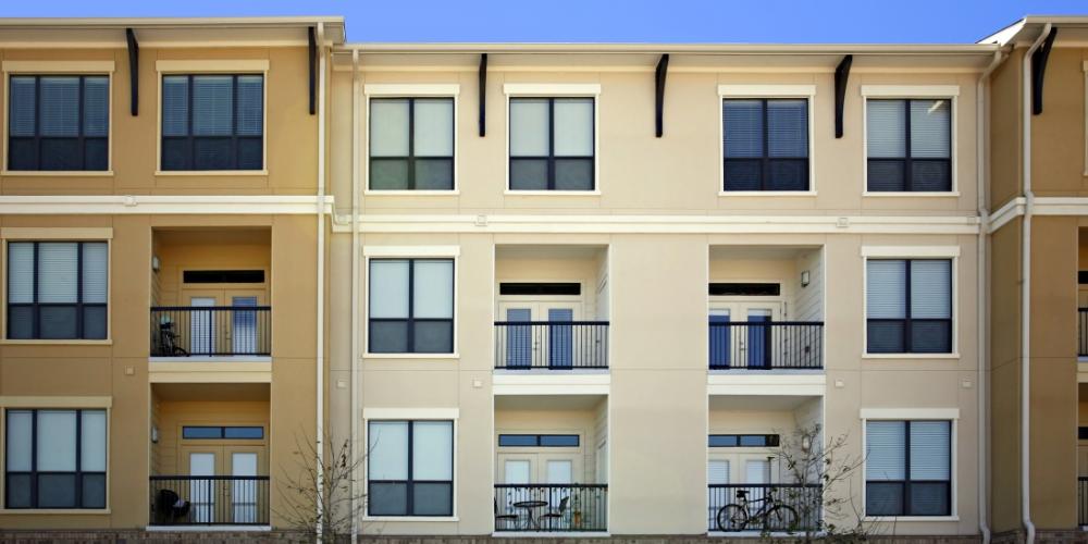 Side view of apartment buildings with balconies. 