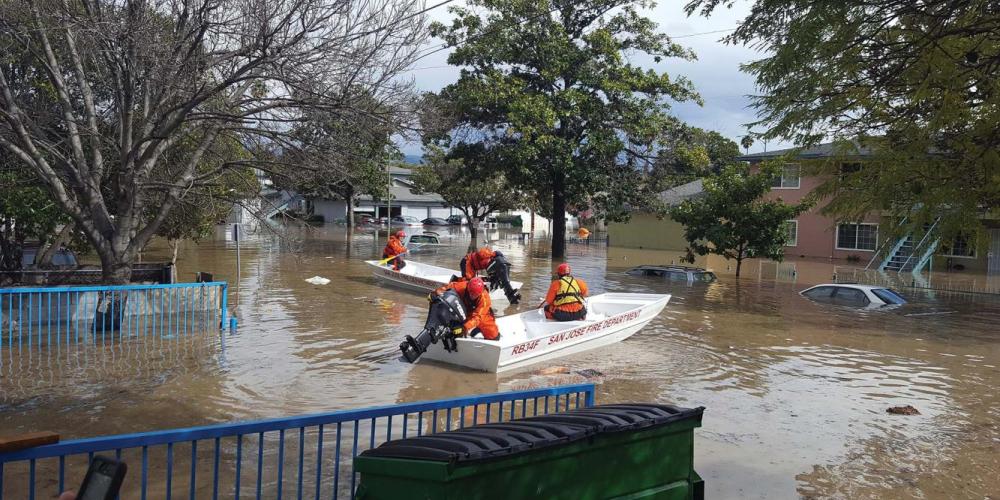 San Jose Fire Department boat in flooded residential neighborhood