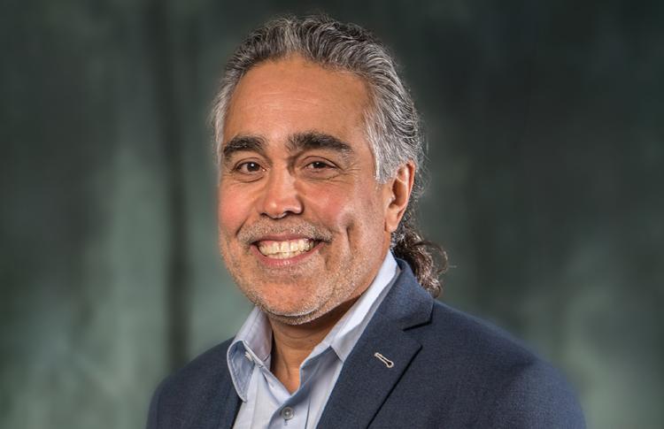 professional headshot of Carlos Romero