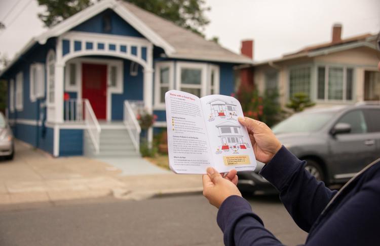 person using an Earthquake Field Guide to assess seismic vulnerability of a residence